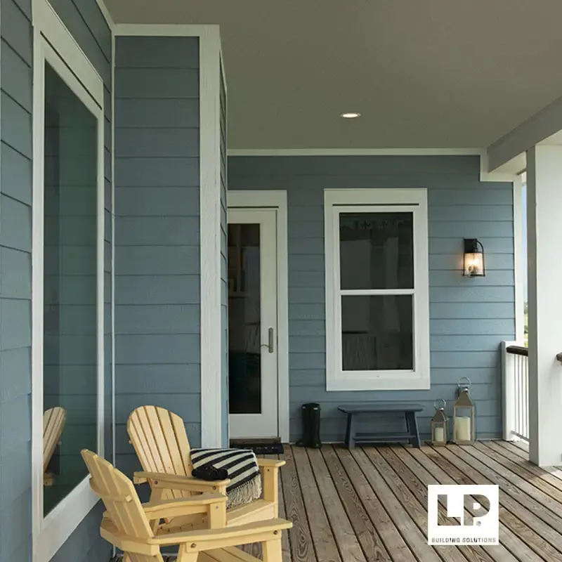 Covered porch with blue lap siding, white trim and yellow Adirondack chairs