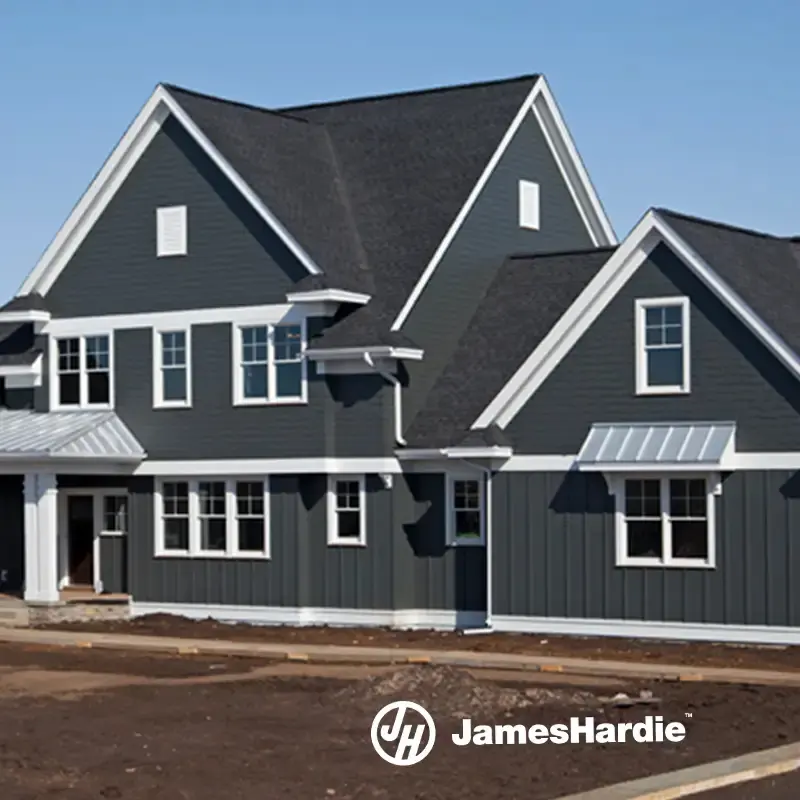 Two-story home with dark gray lap and board-and-batten siding and white trim