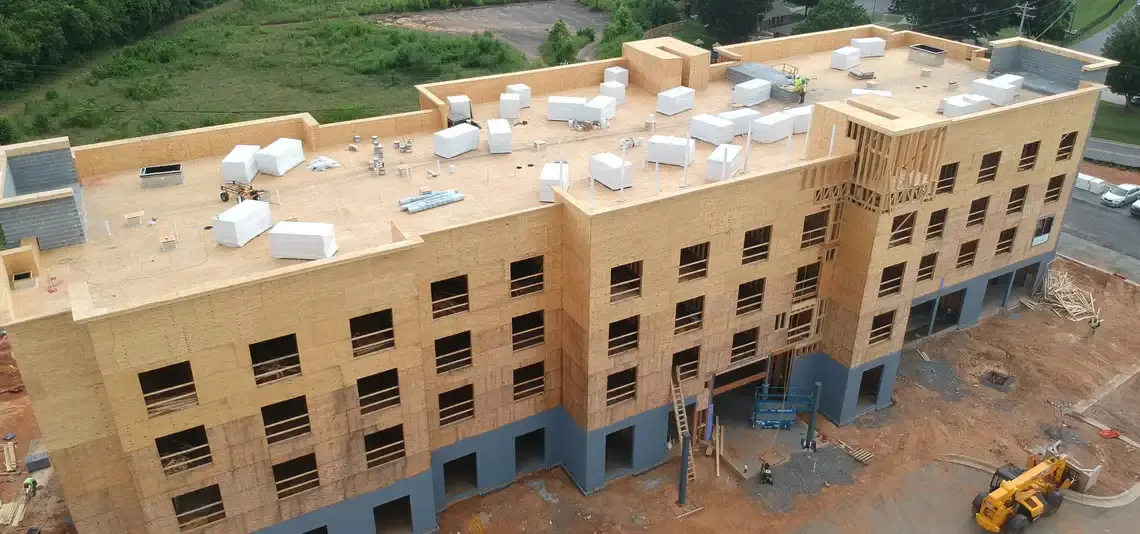 Multi-story hotel framed and sheathed in wood under construction